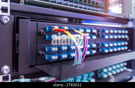 optic fiber cables connected to data center Stock Photo