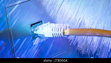 Close-up of an ethernet cable plugged into socket Stock Photo