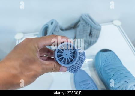 hand with Object printed on 3d printer close-up Stock Photo