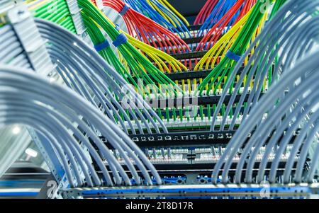 Information Technology Computer Network, colorful Telecommunication Ethernet Cables Connected to Internet Switch. Stock Photo