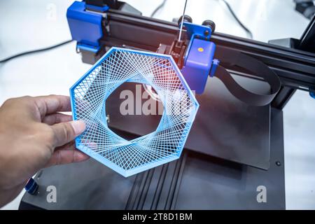 hand with Object printed on 3d printer close-up Stock Photo