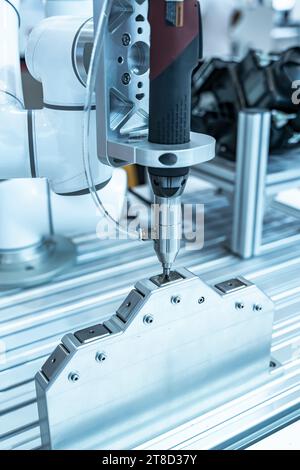 automatic robot drill machine tool at mobile industrial manufacture factory Stock Photo