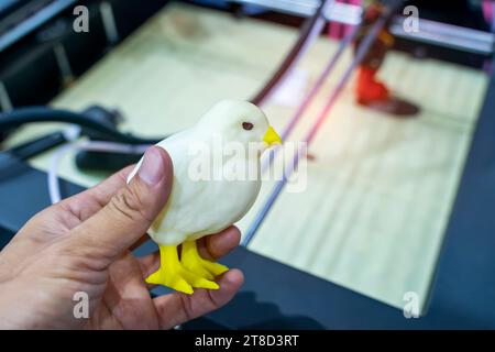 hand with Object of chick printed on 3d printer close-up Stock Photo