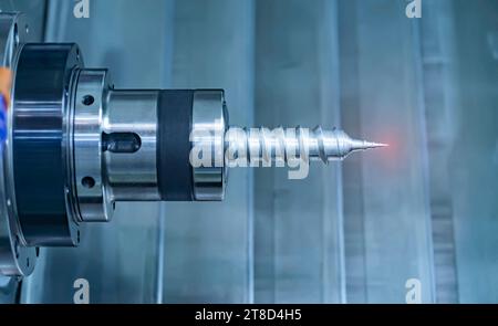 CNC milling machine drilling process on the metal plate.  mold and die manufacturing process by CNC machining center. Stock Photo