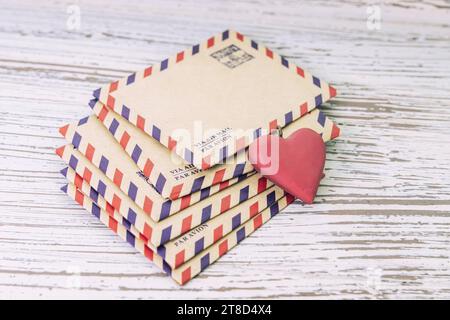 Stack of old letter with shape of love retro heart Stock Photo