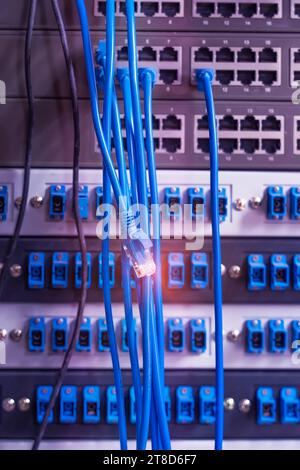 Ethernet cables and Network switch in data center Stock Photo