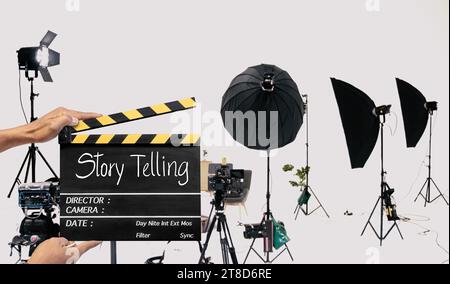 Story telling, Handwriting on film slate or clapperboard .film crew working in the studio. Stock Photo