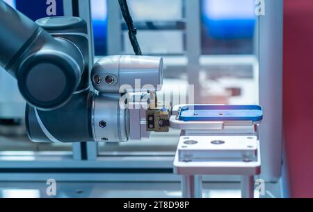 intelligence machine working in mobile phone factory,Smart factory industry 4.0 concept. Stock Photo