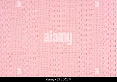 Pink color weave leather texture pattern background. Stock Photo