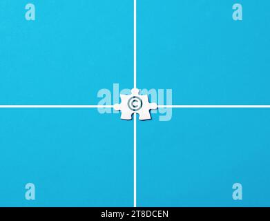 Copyright and patenting concept. Ambiguity in intellectual property rights. Copyright symbol on a jigsaw puzzle piece on blue background. Stock Photo