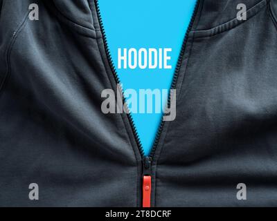 Opened zipper of a hoodie showing the word hoodie on a blue tag. Casual sportswear clothing concept. Stock Photo