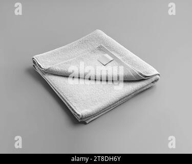 Mockup of a folded white towel with a label, for design, branding, isolated on background. Product photography presentation. Home bath decor. Terry to Stock Photo