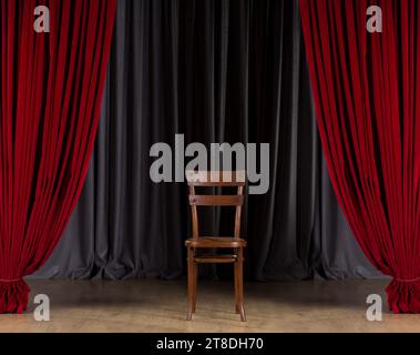 Vintage wooden chair in show stage. Chair on empty stage with red curtains Stock Photo