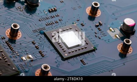 A mobile processor with a removed cooling radiator on a laptop motherboard. Macro photography Stock Photo