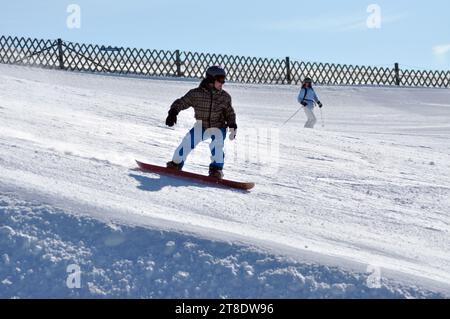 KAPRUN, AUSTRIA - MARCH 5, 2012: Unidentified snowboarder snowboarding down the slope in the Austrian Alps, in Kitzsteinhorn Stock Photo