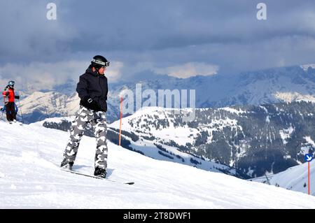 KAPRUN, AUSTRIA - MARCH 5, 2012: Unidentified snowboarder snowboarding down the slope in the Austrian Alps, in Kitzsteinhorn Stock Photo