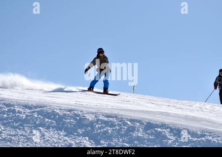 KAPRUN, AUSTRIA - MARCH 5, 2012: Unidentified snowboarder snowboarding down the slope in the Austrian Alps, in Kitzsteinhorn Stock Photo