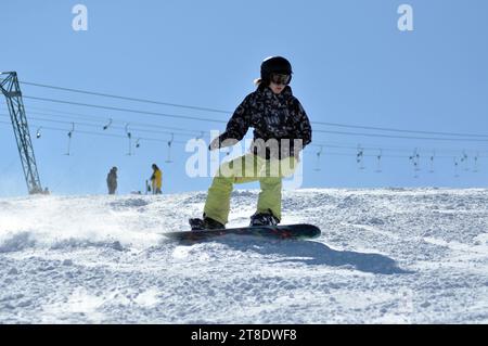 KAPRUN, AUSTRIA - MARCH 5, 2012: Unidentified snowboarder snowboarding down the slope in the Austrian Alps, in Kitzsteinhorn Stock Photo