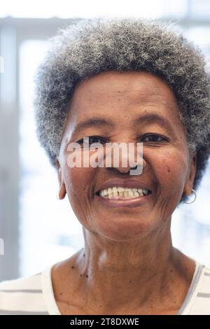Portrait of happy african american senior woman in hospital Stock Photo