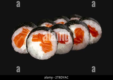 sushi roll with salmon isolated on black  background. Stock Photo