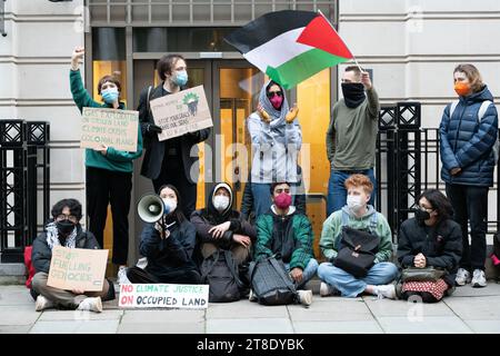 London, UK. 20 November, 2023. Palestine supporters blockade the entrances to oil giant BP's offices in St James's Square in protest against a recent deal with Israel granting licences to exploit offshore gas reserves. The deal, involving a partnership with the Azerbaijan regime and Israel's NewMed, was made as Israel re-occupies and wages a devastating offensive on Gaza and activists accuse the oil major of 'colonial exploitation'.  Credit: Ron Fassbender/Alamy Live News Stock Photo