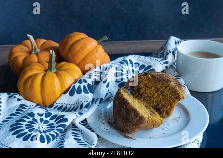 Overhead view  of pumpkin muffin and coffee cup. Stock Photo