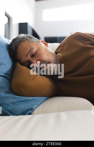 Senior man sleeping on a couch isolated on white background Stock Photo ...