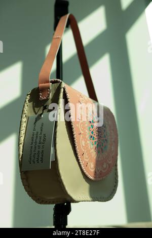 Leather purse with a spiritual drawing on display Stock Photo