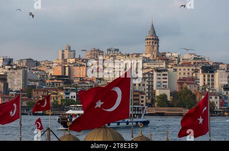 Eminönü, Istanbul, Turkey - October 17th 2019 - View of Golden Horn and Galata Tower from Eminönü square. Turkish flags and old Istanbul view. Stock Photo