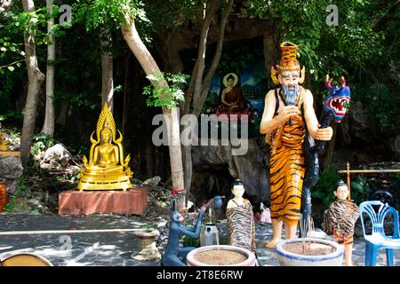 Ancient hermit or antique eremite statues at Cavern for thai people travelers respect praying blessing buddha and myth mystery of Wat Tham Nam or Wate Stock Photo