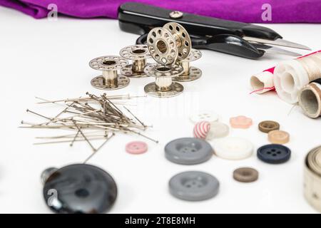 Horizontal photo, sewing material presented on a white table, for manual textile works. Stock Photo