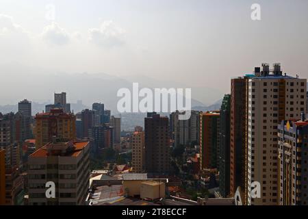 La Paz, BOLIVIA; November 20th 2023: Smoke caused by forest fires in Bolivia's lowland Amazon and Yungas regions covers the city in a haze, obscuring the nearby hills and mountains. Several hundred forest fires are currently burning in the lowlands; the region around Rurrenabaque and San Buenaventura (including Madidi National Park) is particularly affected. Credit: James Brunker / Alamy Live News Stock Photo