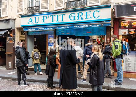 Paris, France, Crowds buying fast food in the street (rue mouffetard) of Paris, Editorial only. Stock Photo