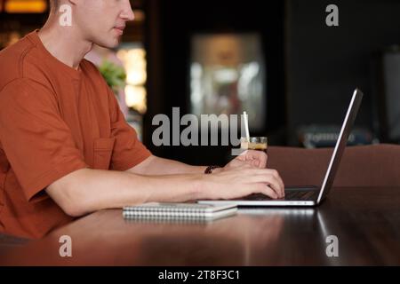 Cropped image of young software developer working on laptop when studying programming Stock Photo