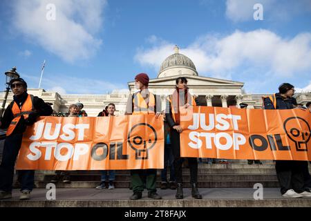 London, UK. 20th Nov, 2023. Activists from climate justice group Just Stop Oil (JSO)gather at Trafalgar Square in central London prior to their slow march. Climate activists from Just Stop Oil starts their week long of daily slow march at Trafalgar Square in Central London to demand the UK Government to stop any new oil investment. The group swiftly arrested by the Met Police under section 7 of Public Order Acts. Credit: SOPA Images Limited/Alamy Live News Stock Photo