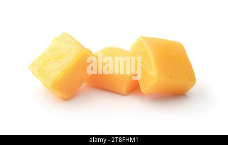 Heap of mango candy cubes isolated on white. Stock Photo