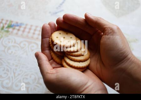 Cookie crackers with salt in arms close Stock Photo