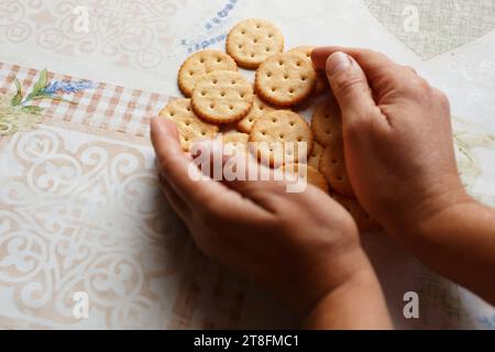 Cookie crackers with salt in arm close Stock Photo