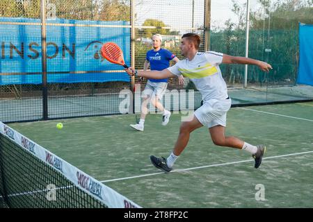 Two young men playing a padel match. Stock Photo