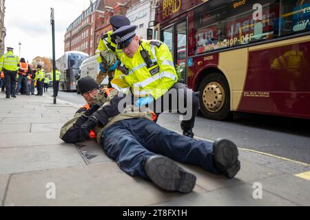 London, UK. 20th Nov, 2023. Just Stop Oil activists have been seen being handcuffed and dragged into the back of police vans in Central London after the Metropolitan Police shut down another slow march in the capital. Just Stop Oil said it would be staging daily marches from Trafalgar Square from November 20 in its bid to get the Government to end new oil and gas licences. (Credit Image: © Velar Grant/ZUMA Press Wire) EDITORIAL USAGE ONLY! Not for Commercial USAGE! Credit: ZUMA Press, Inc./Alamy Live News Stock Photo