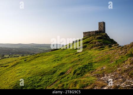 Morning light shines on the hilltop church of St Michael de Rupe on Brent Tor hill in Dartmoor, West Devon. Stock Photo