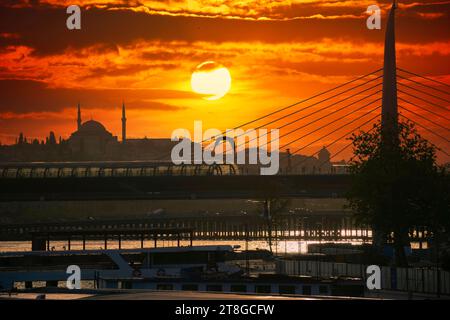 Istanbul is the dream city between the European and Asian continents. Sunset view of Istanbul from the Golden Horn metro bridge. Stock Photo