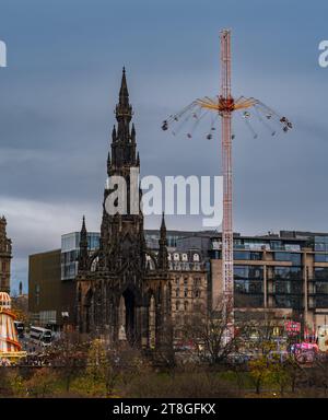 Edinburgh, Scotland, UK, 20th November 2023. The lights of Christmas decorations, Christmas market and star flyer funfair ride in Princes Street Gardens are an attraction in the dusk light. Credit: Sally  Anderson/Alamy Live News Stock Photo