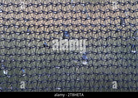 Fine mesh of synthetic thread on the edges of the trampoline Close-up shot Stock Photo