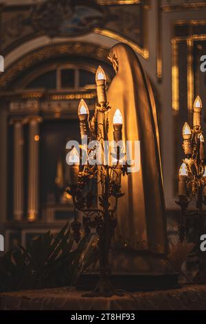 Maria and candles, church interior, Mexico, Tehuacan, Puebla, 2022 Stock Photo