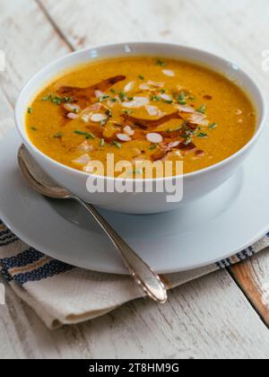 Bowl with a home made Almond, Winter Squash Bisque. Stock Photo