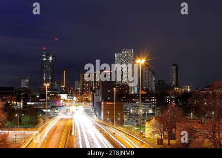 A view of Leeds City Centre at rush hour from a footbridge over the A58M Stock Photo