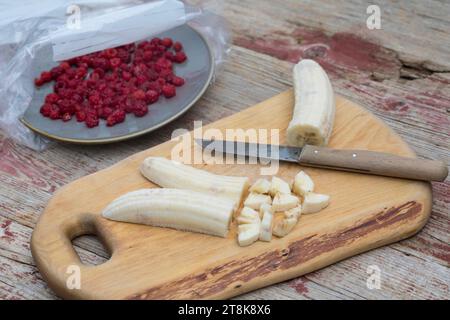 selfmade soft ice cream made of yogurt, qvark and fruits, bananas are chopped, series picture 1/4 Stock Photo