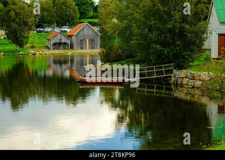 ALESUND, NORWAY - September 12 2023: Sunnmore Museum is an open air museum with 56 old homes with sod roofs, and one of the largest boat collections i Stock Photo
