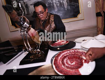 Paris, France. 20th Nov, 2023. A chef prepares 5J Cinco Jotas iberico ham at the unveiling ceremony of LA LISTE 2024 world restaurant ranking at the French Ministry of Foreign Affairs in Paris, France, Nov. 20, 2023. LA LISTE 2024, the latest update of a list of the best global restaurants, was unveiled here on Monday. Credit: Gao Jing/Xinhua/Alamy Live News Stock Photo